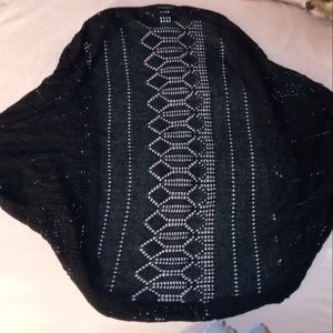 Short sleeved black cardigan.